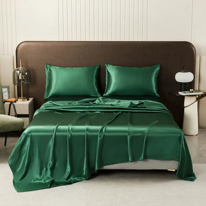 Emerald green satin bedding set by decorbites featuring a smooth glossy finish and matching flat sheet and pillowcases