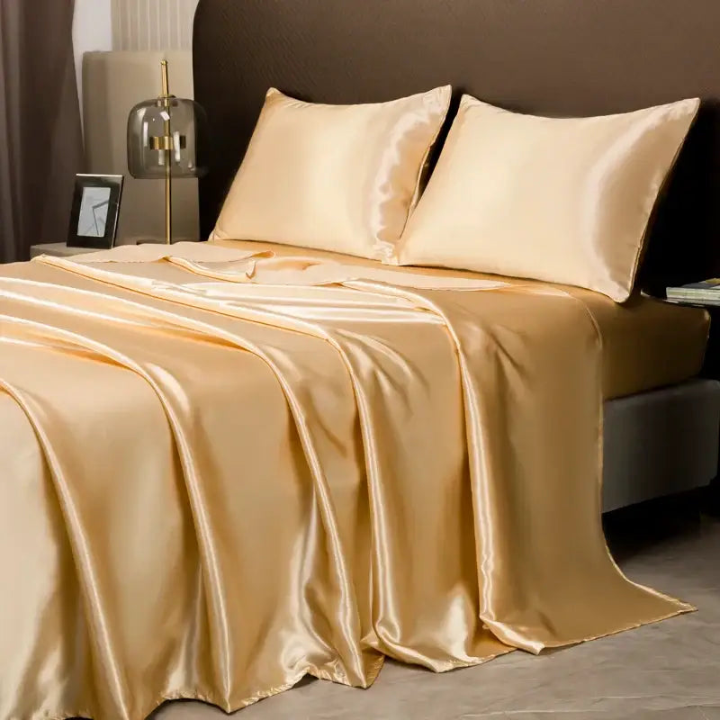 Glossy gold satin bedding set with flat sheet and matching pillowcases from decorbites opulent satin bedding set