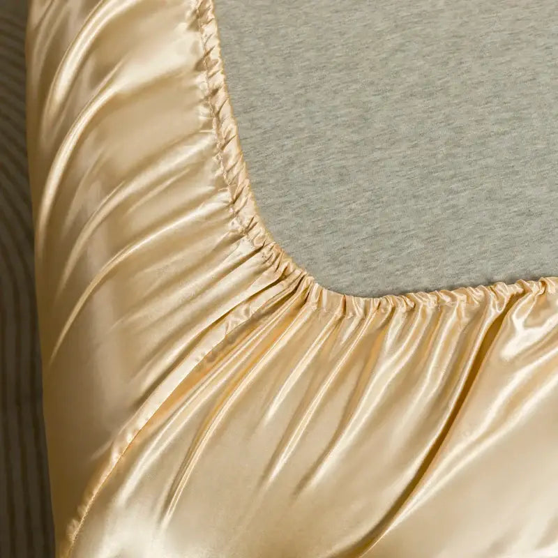 Gold satin bedding set from DecorBites™ with smooth glossy finish and elasticized edge flat sheet for luxury comfort