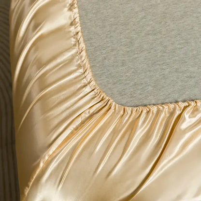 Gold satin bedding set from DecorBites™ with smooth glossy finish and elasticized edge flat sheet for luxury comfort