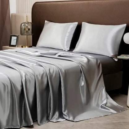 Silver satin bedding set by DecorBites™ featuring a smooth glossy finish with matching flat sheet and pillowcases