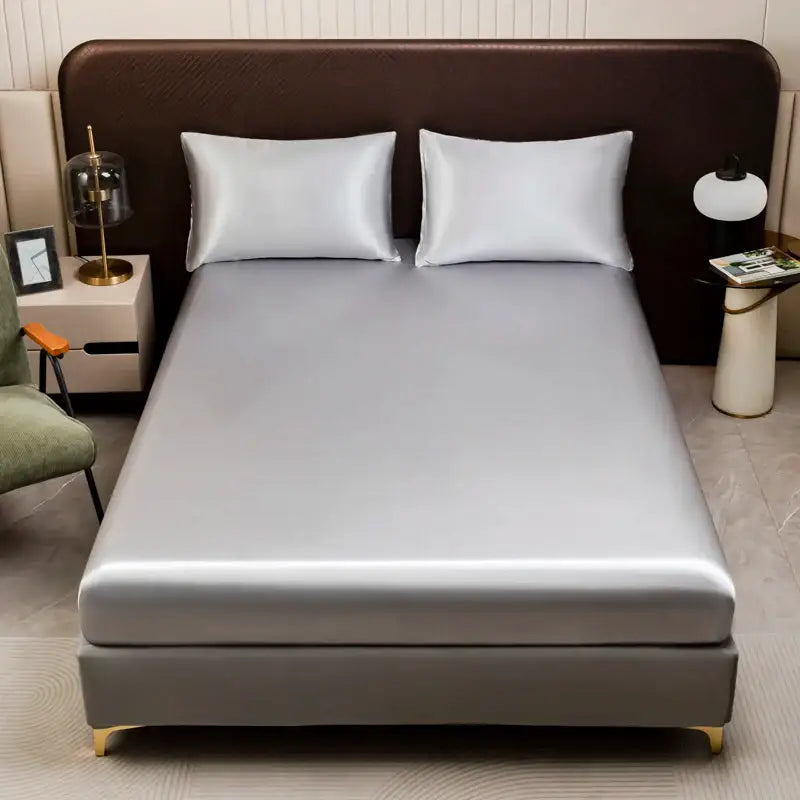 Silver satin bedding set by DecorBites™ featuring a smooth flat sheet and matching pillowcases with elegant sheen
