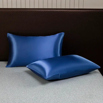 Two royal blue satin pillowcases with a smooth glossy finish from DecorBites™ opulent solid color satin bedding set