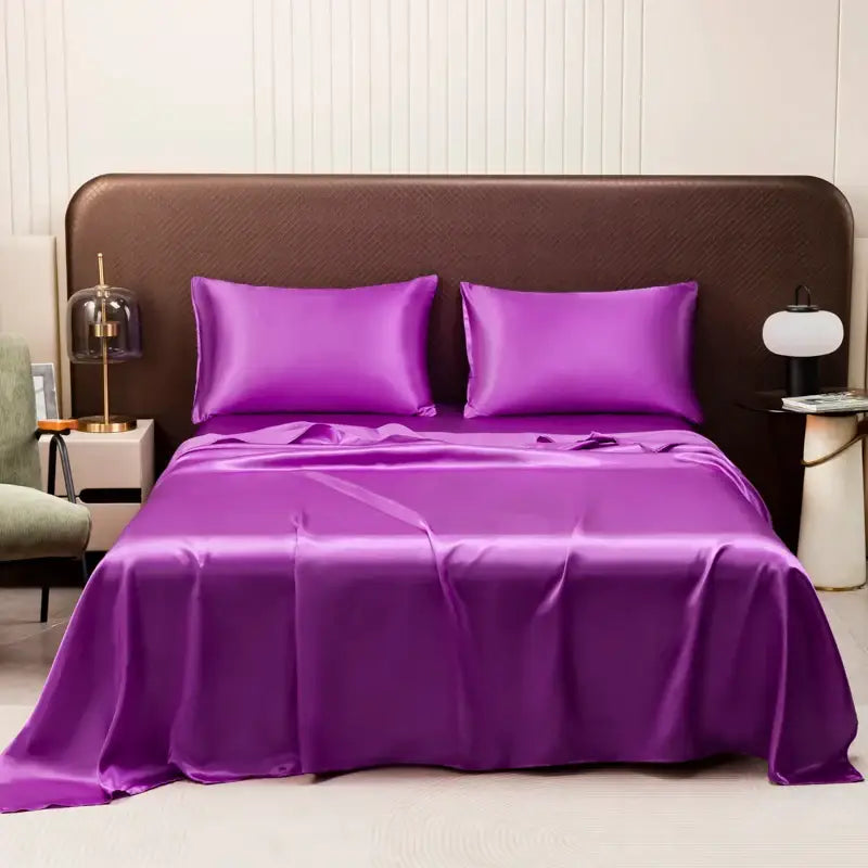 Vibrant purple satin bedding set by DecorBites™ featuring a smooth glossy finish and matching pillowcases