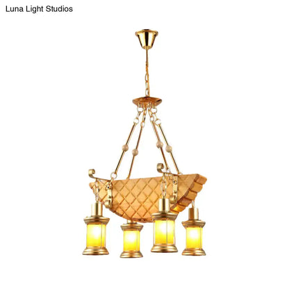 DecorBites™ orange glass pendant light with fish guitar design and quilted amber glass bowl in farm gold finish