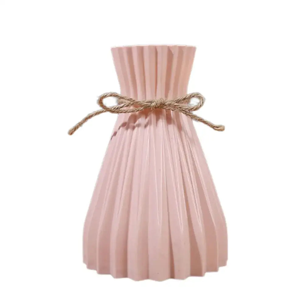 A blush pink origami vase plastic flower vase decorated with rustic twine bow from decorbites™ collection
