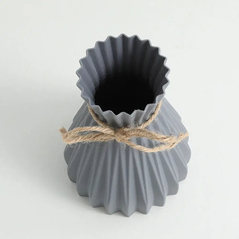 Gray ceramic origami flower vase with fluted scalloped rim and natural twine tied waist by DecorBites™