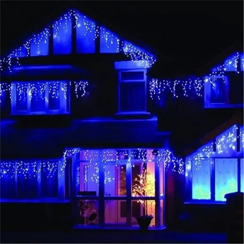 Decorbites™ outdoor christmas waterfall curtain string lights with blue led icicles adorn house roofline and windows