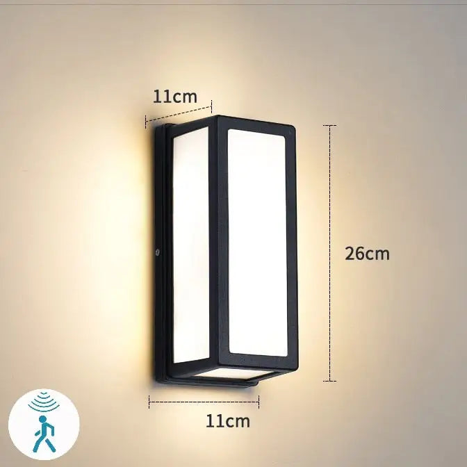 Black rectangular decorbites™ outdoor motion activated led porch light with frosted glass panels and modern design