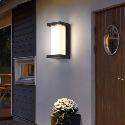 Modern black-framed led porch light with frosted glass diffuser emitting warm light by DecorBites™ for outdoor use
