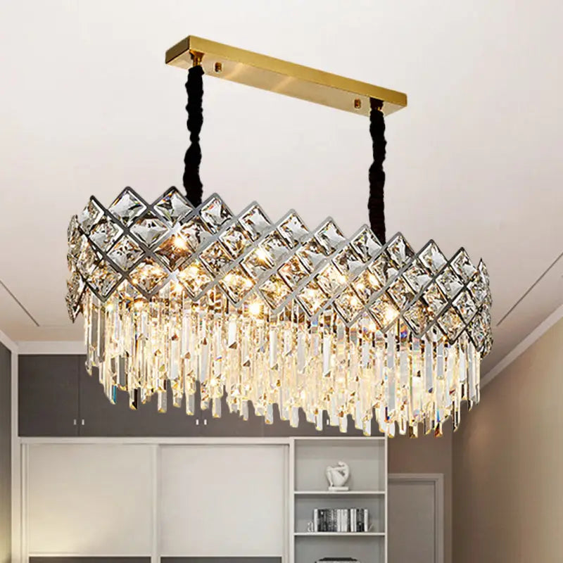 Elegant gold-toned DecorBites island light fixture with geometric crystal design and cascading clear glass prisms