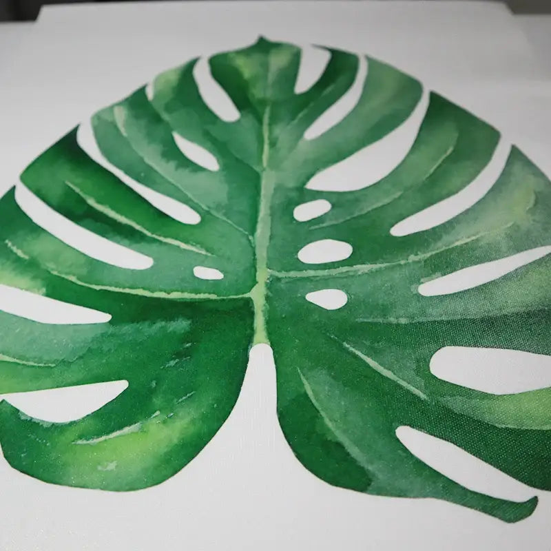 A vibrant green monstera leaf watercolor wall art print on fabric from decorbites™ personalized custom canvas