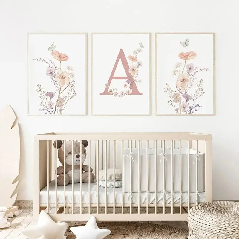 Set of three framed pink floral wall art prints with letter a in watercolor on off-white paper for nursery decor
