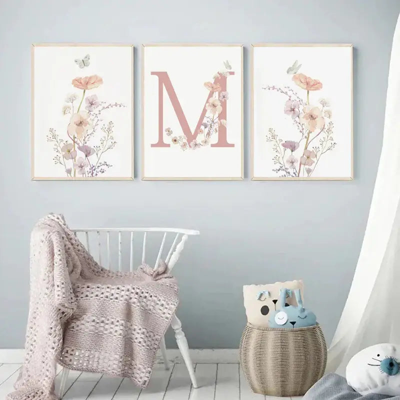 DecorBites™ personalized pink floral wall art with light wood frames and rose-pink letter m on pink floral canvas