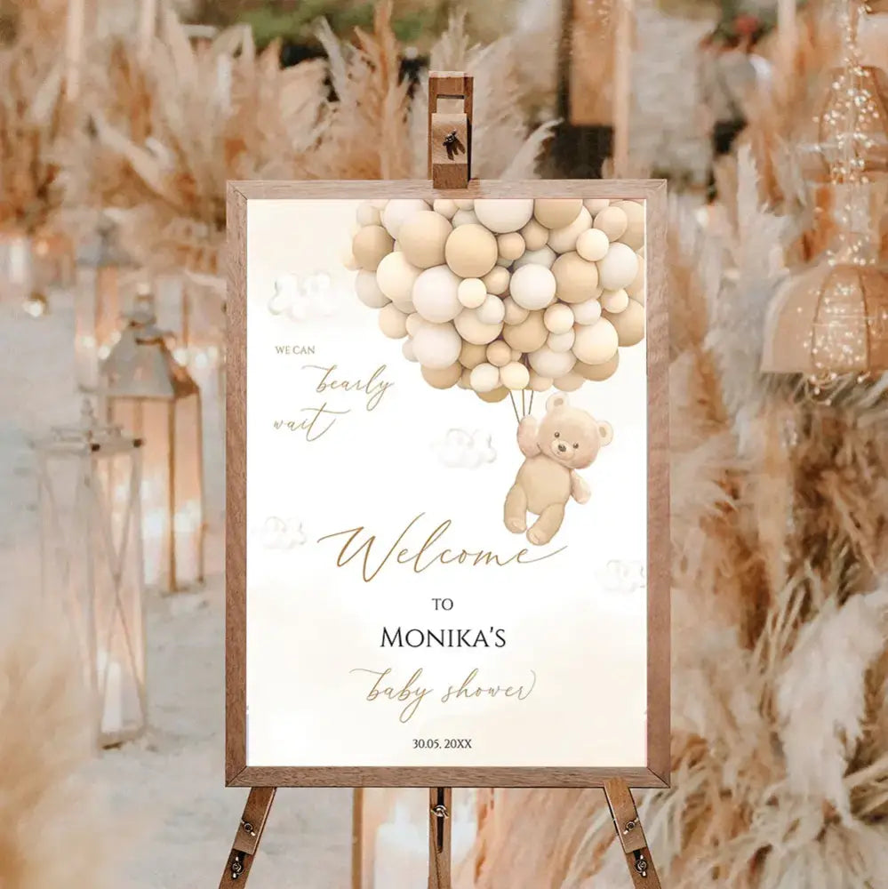 DecorBites™ personalized teddy bear baby shower welcome sign with beige bear holding balloons on cream cloud background