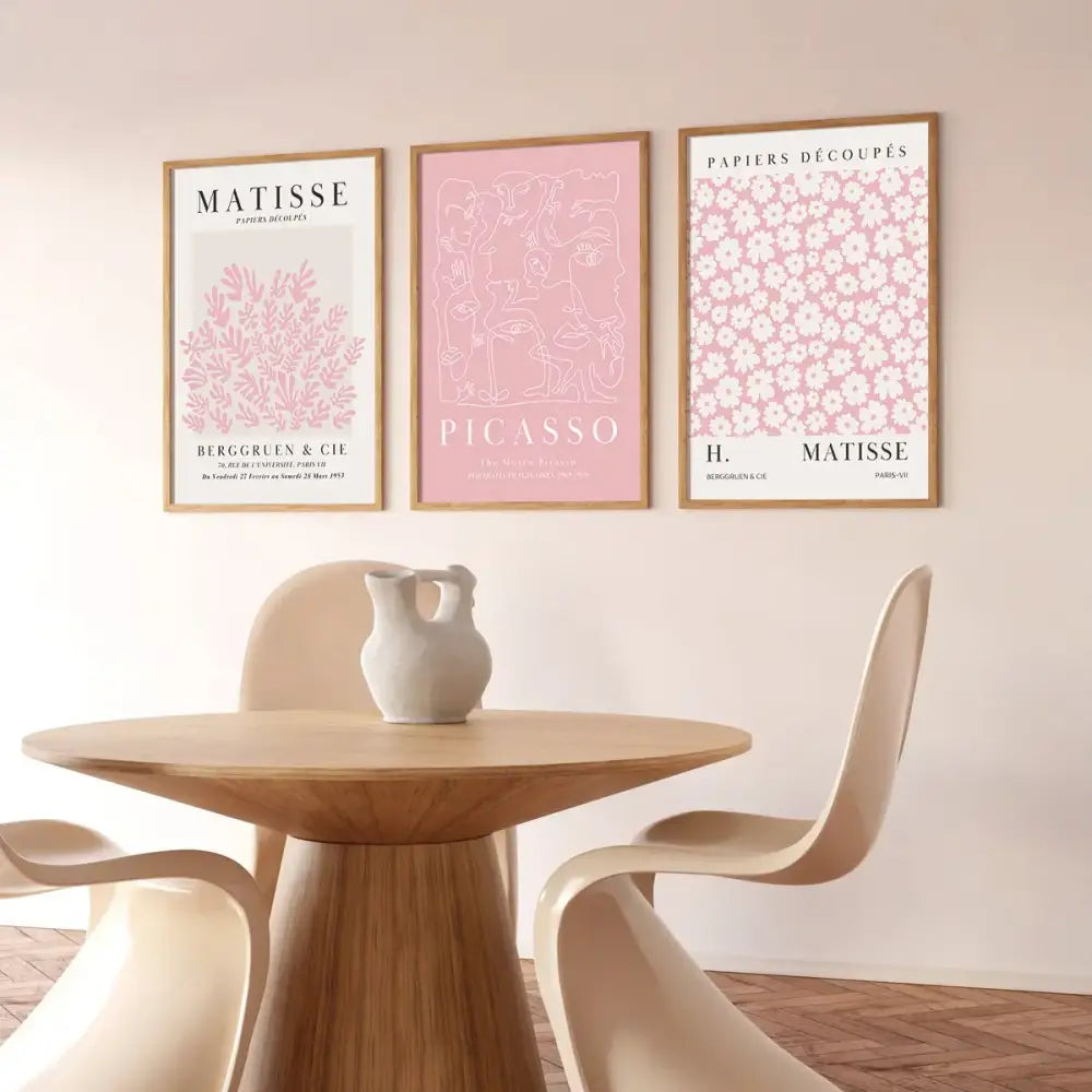 A minimalist white ceramic pitcher with matte finish and two handles on wooden table in decorbites pink abstract sage wall art set