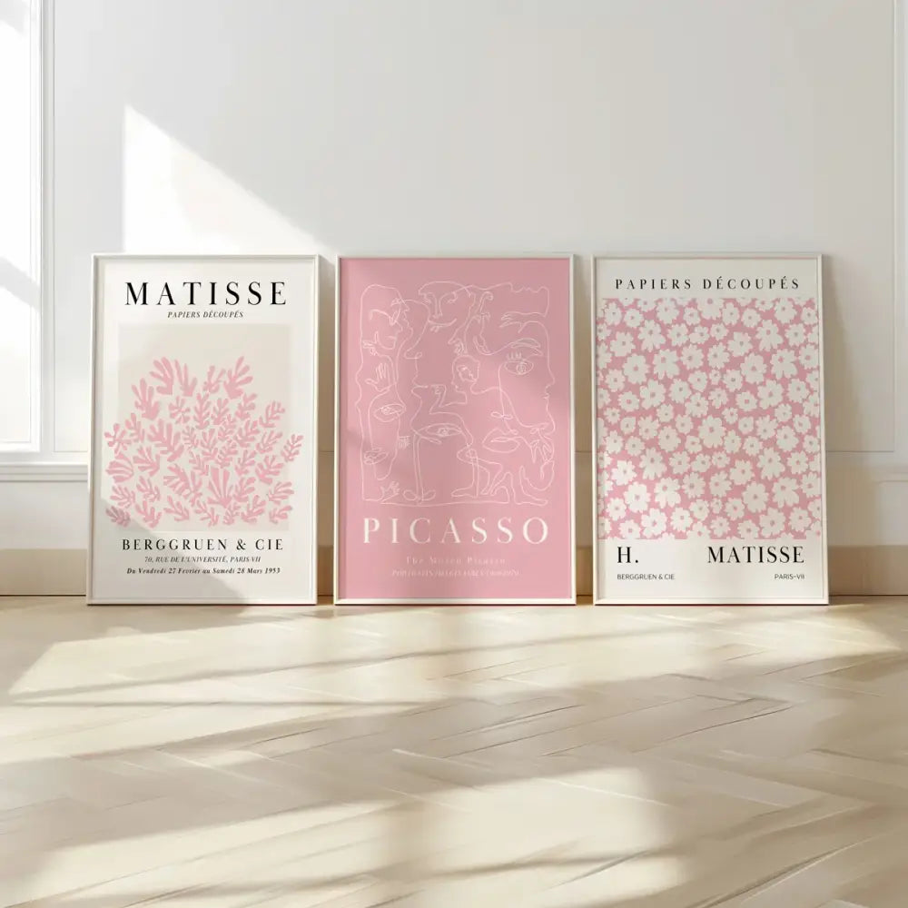 Three framed pink abstract sage wall art set featuring paper-cut designs by matisse and picasso displayed on a wall