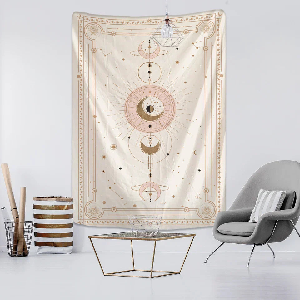 A cream-colored tapestry with intricate celestial designs in gold and soft pink accents pink planet tarot wall hanging