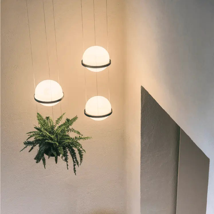 Decorbites™ planter light pendant chandelier with three softly glowing white spherical light pendants and black rims