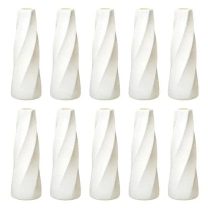 Set of ten white ceramic flower vases with sleek twisted design for modern home decor and floral displays