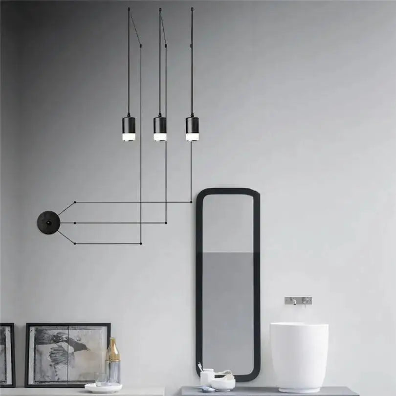 Decorbites™ plug-in hanging lights feature black cylindrical minimalist plug-in hanging lights for modern interiors