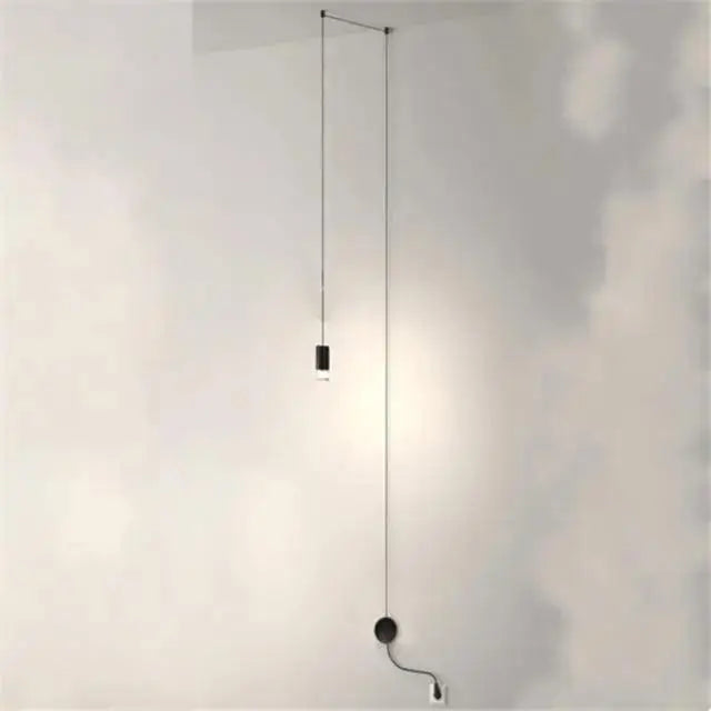 Minimalist black cylindrical pendant light with thin cord wall mount for decorbites™ plug-in hanging lights collection