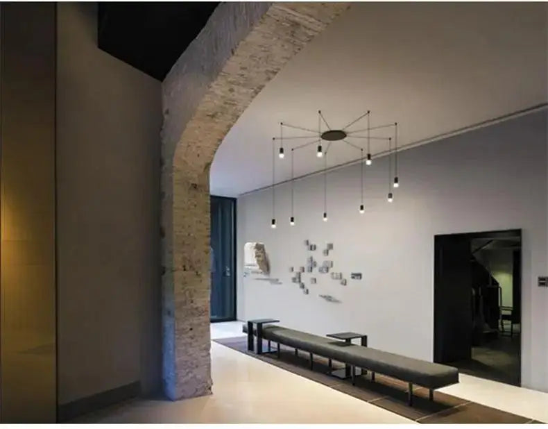 Modern minimalist chandelier with black metal arms and exposed bulbs in decorbites™ plug-in hanging lights design