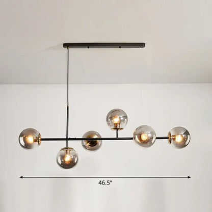 Modern black metal chandelier with six smoked glass globe bulbs by decorbites for beige grey blue dining rooms