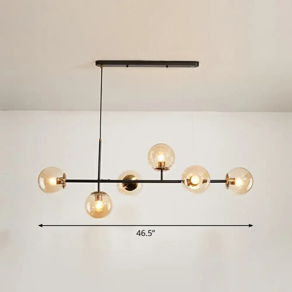 Modern black metal chandelier with six warm-toned glass globe bulbs for dining rooms in grey blue white decor settings