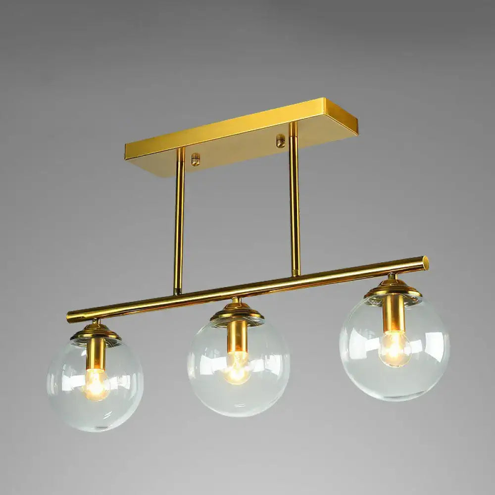 Decorbites modern brass pendant light with three clear globe glass shades for stylish ceiling illumination