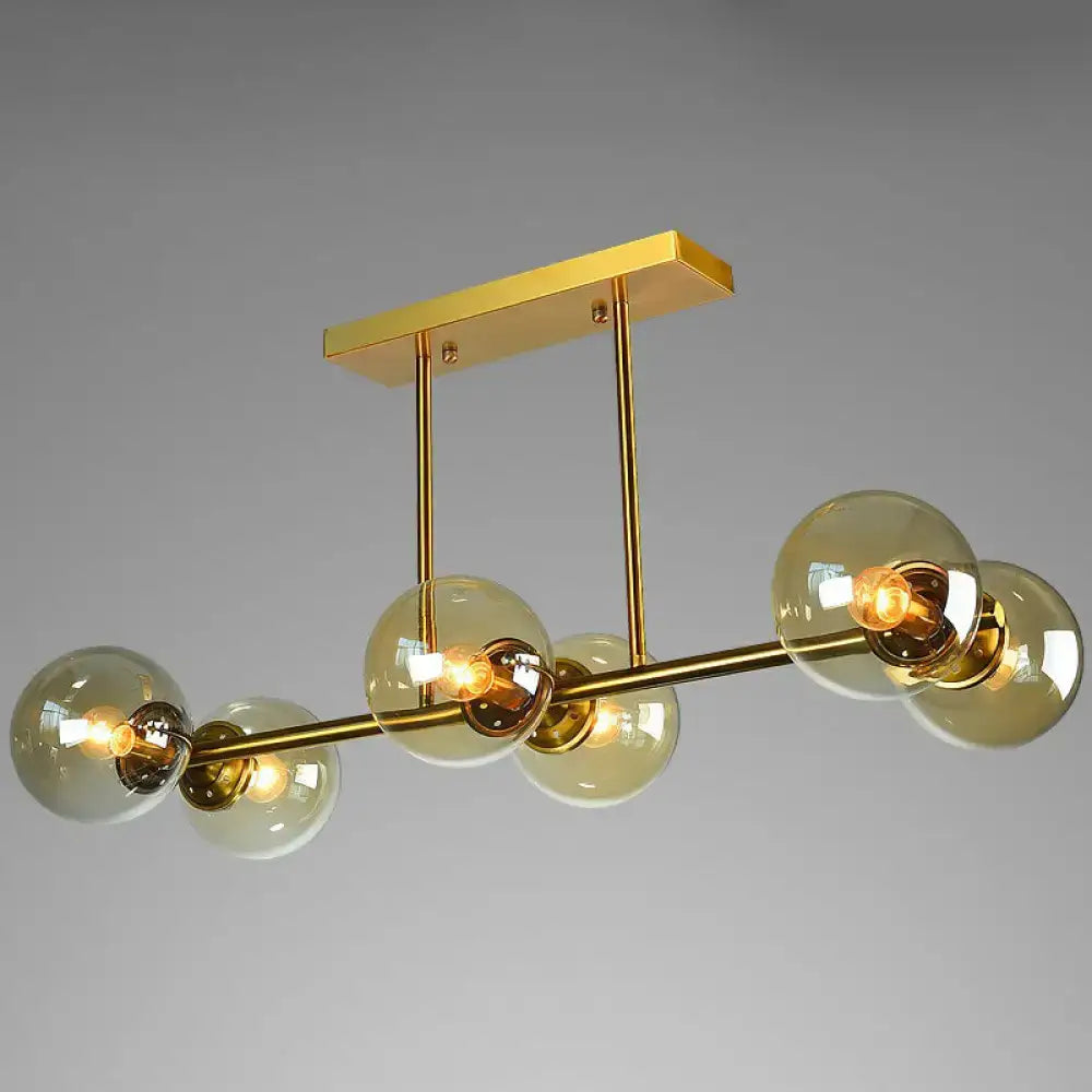 Decorbites™ postmodern brass island light with gold-toned metal frame and five amber globe glass shades ceiling fixture