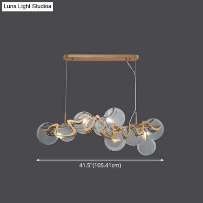 Modern gold-toned DecorBites™ postmodern circle pendant light with clear glass spheres and sculptural metal accents is an elegant light fixture suitable for LED incandescent fluorescent use