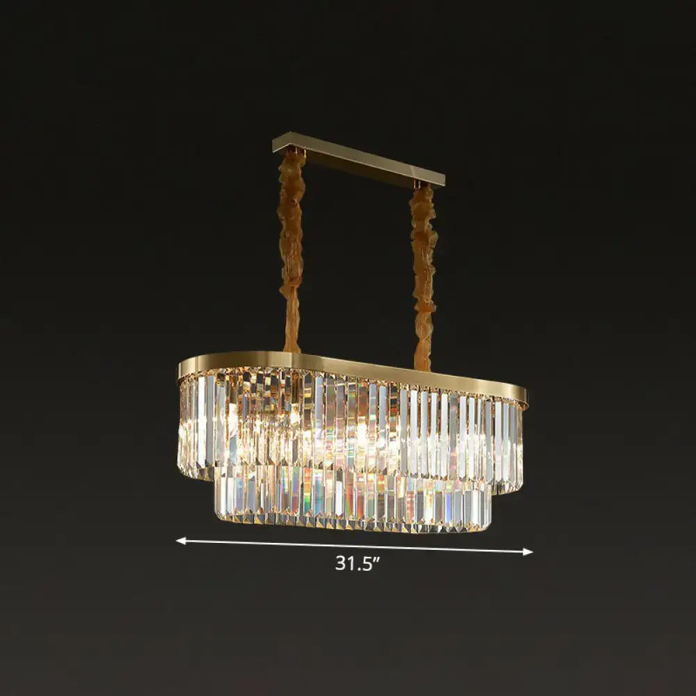 Gold-toned DecorBites postmodern oblong island light with two tiers of clear crystal rods and twisted bronze chains