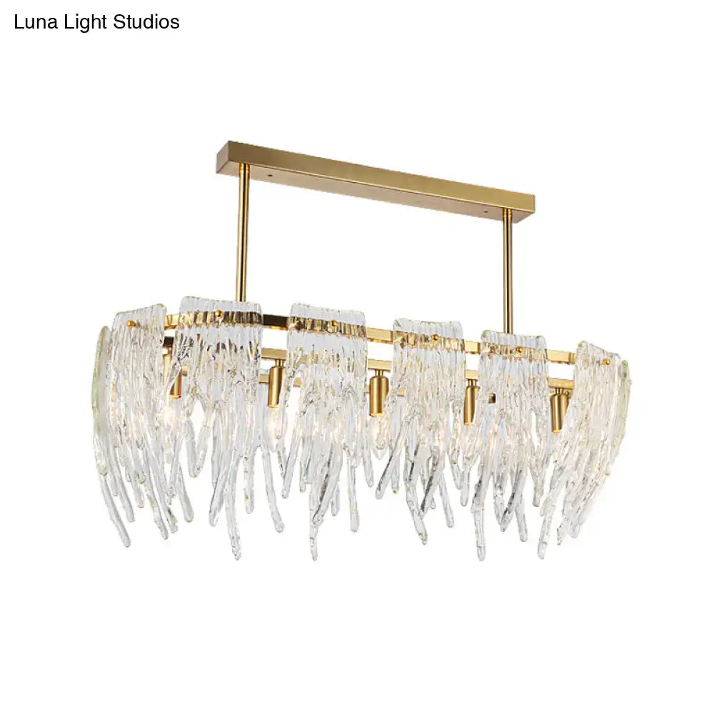 Elegant gold-toned DecorBites™ postmodern crystal island pendant light with cascading prisms for dining room use