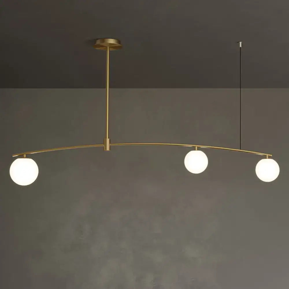Decorbites postmodern gold island pendant light with brass finish and three frosted white glass orb hanging lamps