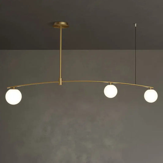 Decorbites postmodern gold island pendant light with brass finish and three frosted white glass orb hanging lamps