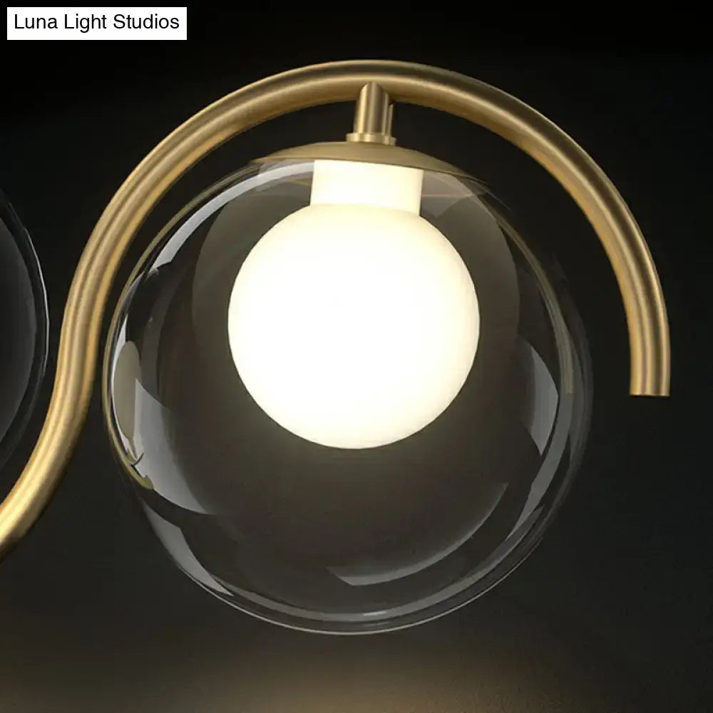 Decorbites postmodern hanging lamp with sleek brass arm and clear glass shade featuring an illuminated bulb