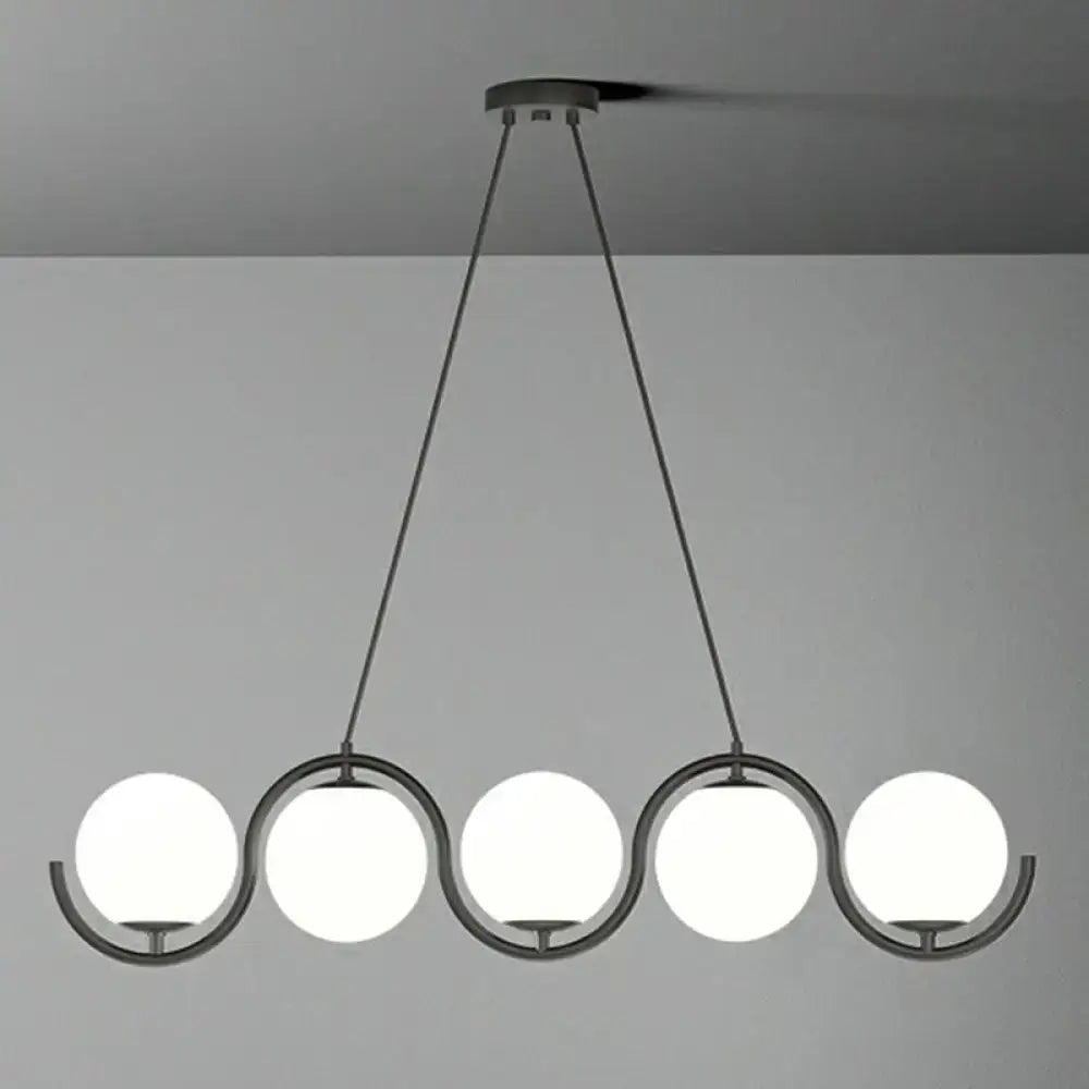 DecorBites™ postmodern black metal hanging lamp with five clear milk white glass shades in a wavy arrangement