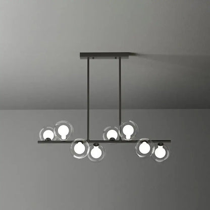 Modern black metal light fixture featuring clear glass spheres with glowing bulbs in decorbites postmodern led island light