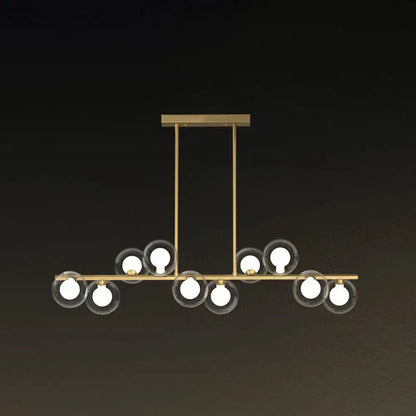 Modern brass light fixture with clear glass globe shades and exposed bulbs for postmodern led island lighting