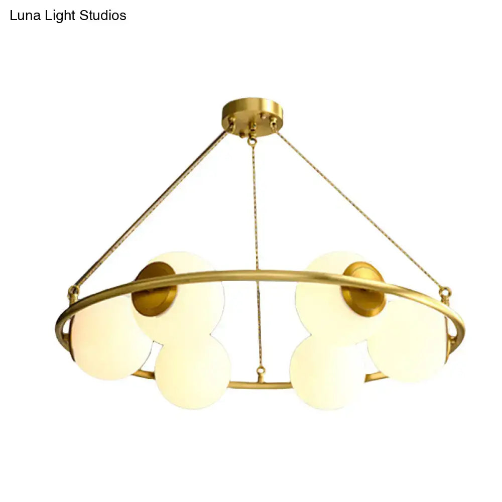 Decorbites postmodern metal chandelier with brass finish circular frame and frosted glass globe shades 6 8 lights