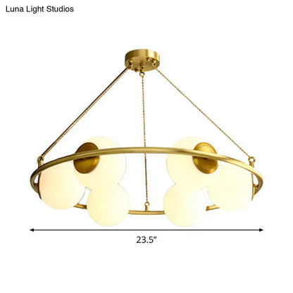 Decorbites postmodern circular chandelier light with six frosted glass shades in brass finish metal frame