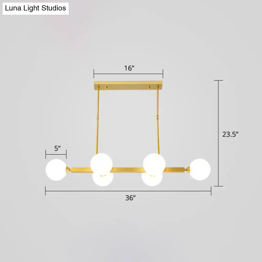 Gold-toned DecorBites™ postmodern opaline glass molecular island pendant light with five frosted globe bulbs for dining room