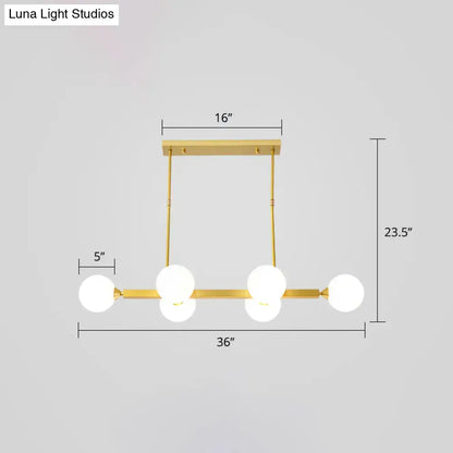 Gold-toned DecorBites™ postmodern opaline glass molecular island pendant light with five frosted globe bulbs for dining room