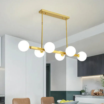 Gold-toned DecorBites™ postmodern pendant light with five opaline glass molecular bulbs for dining room use