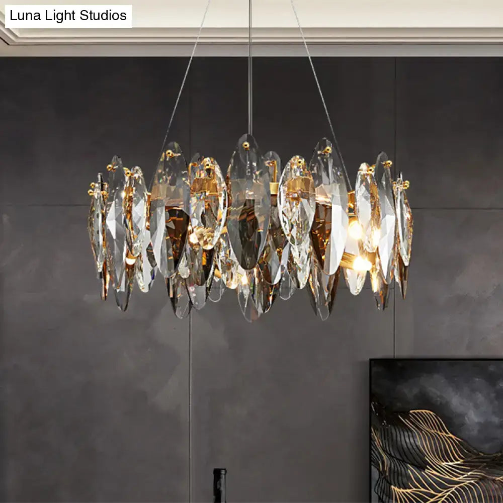 A modern postmodern smoke grey glass leaf suspension lamp with faceted crystals and gold fittings for restaurant islands