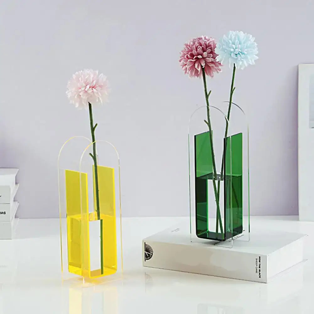 Modern acrylic flower vases in vibrant yellow and emerald green with sleek arched tops in nordic style decorbites rainbow color design
