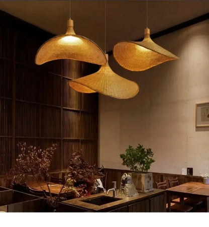 Three golden-brown woven bamboo pendant lights with dimmable rattan shades for natural pendant light rattan decor