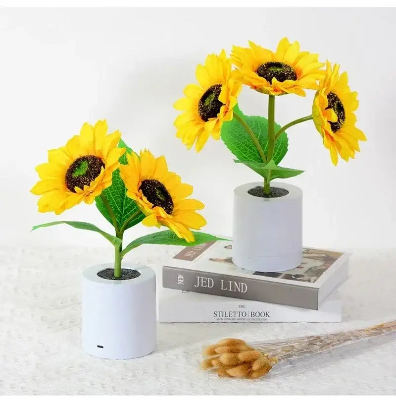 White cylindrical planters with artificial yellow sunflowers featuring decorbites rechargeable led night light for bedroom