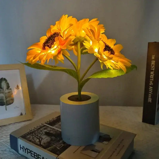 DecorBites™ rechargeable sunflower led night light with glowing yellow petals and light blue cylindrical pot